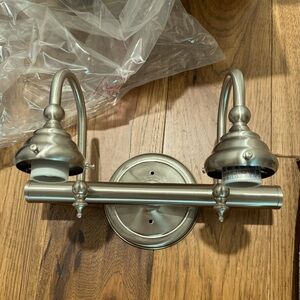 Brunswick 2 light 17” satin nickel bathroom vanity wall light by Savoy House